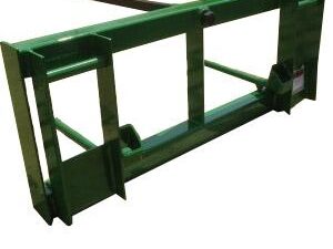 The John Deere Bale Spear 246 is a green metal hay spear attachment for a tractor, featuring a single tine and a frame with brackets for attachment. Compatible with John Deere models, this bale spear ensures efficient handling of bales.