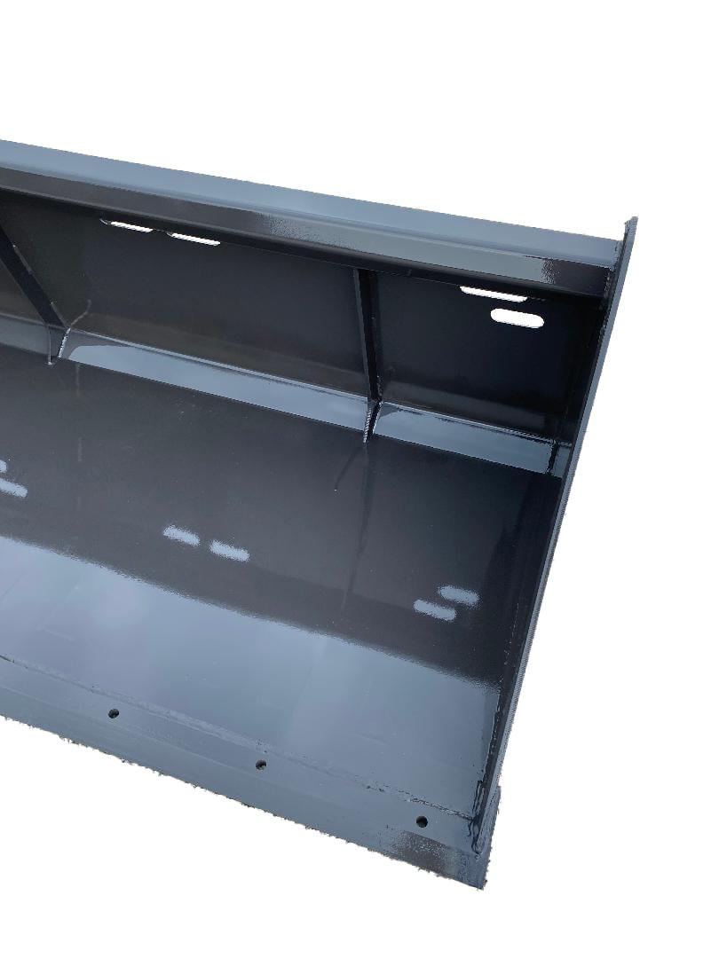 Close-up of the Skid-Steer Snow Bucket – Utility, featuring a glossy black metal structure with multiple horizontal and vertical components, complete with slots and holes for assembly or attachment, resembling a robust skid-steer utility frame.