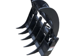 A black, heavy-duty Dingo Root Rake with multiple curved tines sits on a gravel surface.